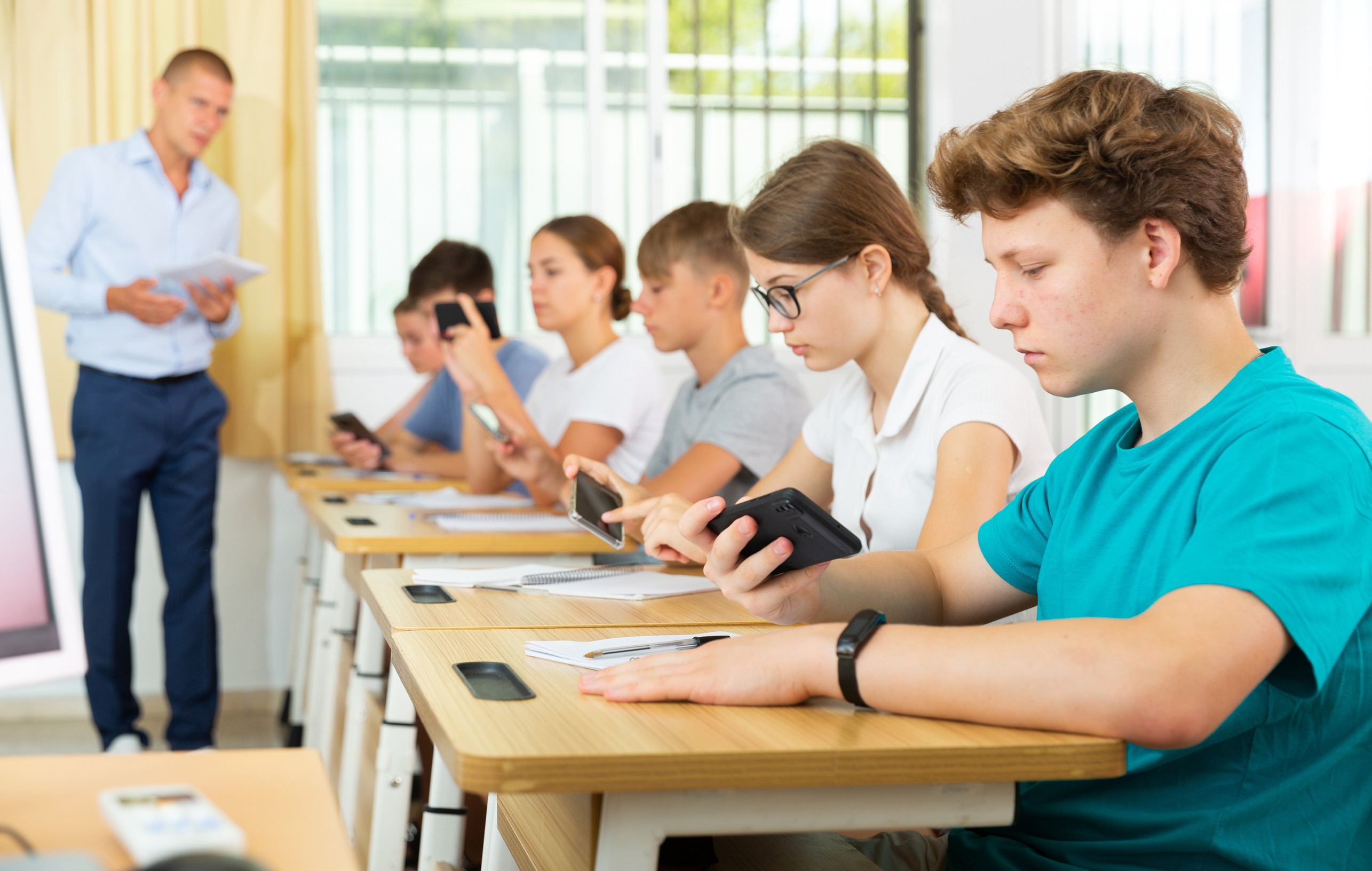 Students using tablets in modern classroom